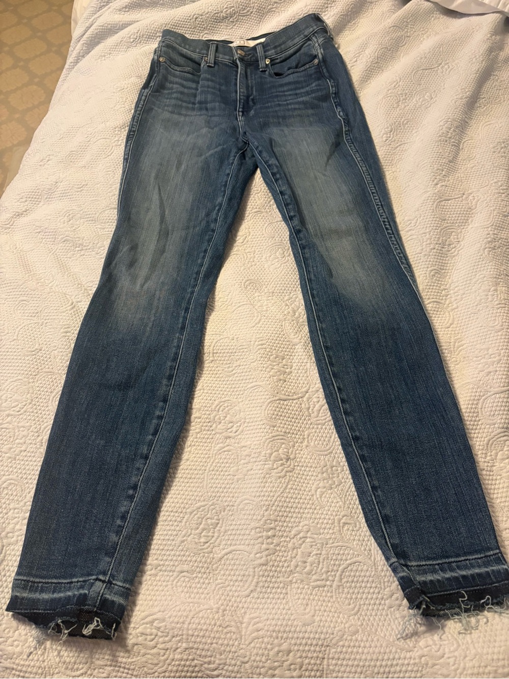 AYR The Riser Jean in a class blue wash with a frayed hem. Size 26 waist by 28L